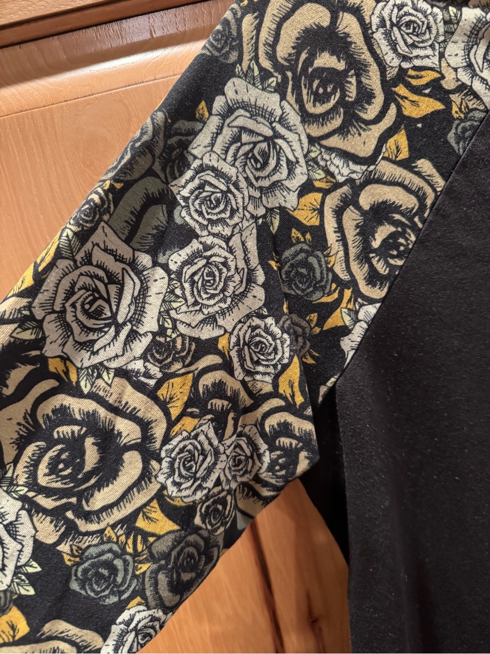 LuLaRoe Black Top with Gold and Green Rose Raglan Sleeves - Picture 2 of 5